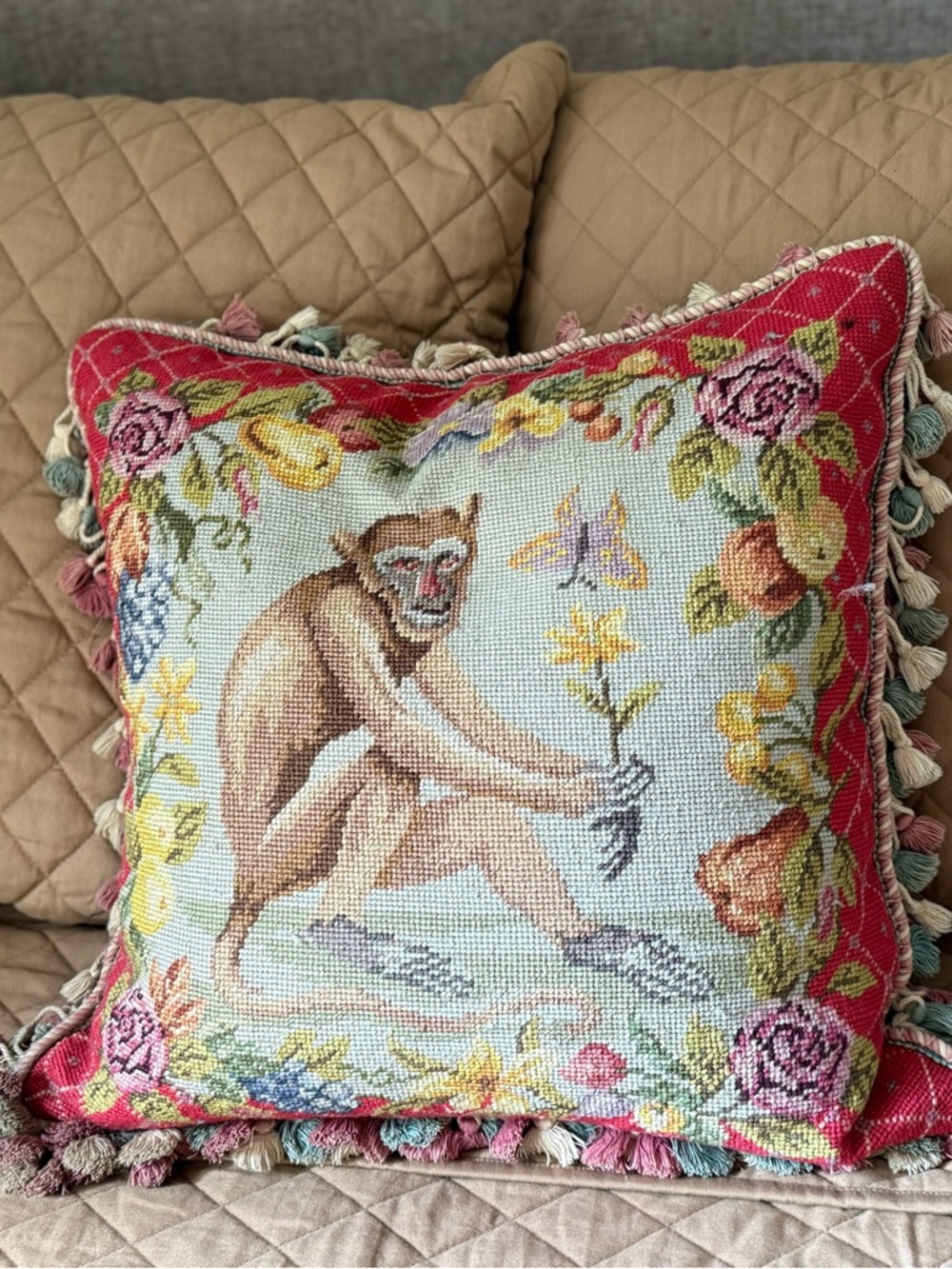 Two Vintage Needlepoint Monkey Needlepoint Pillows with floral background